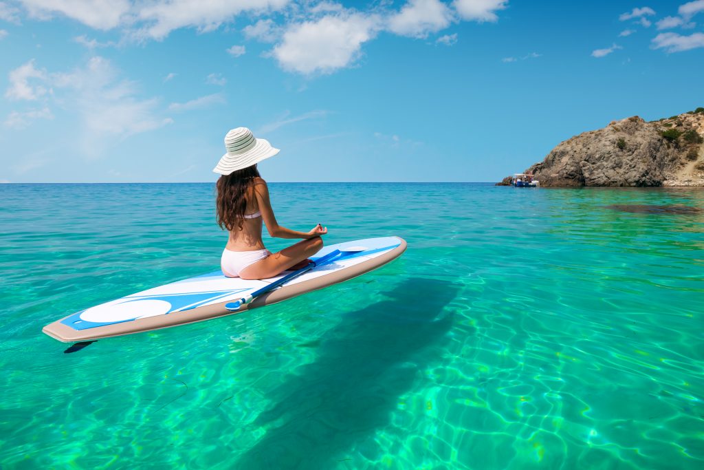 Woman on paddleboard in Hawaii